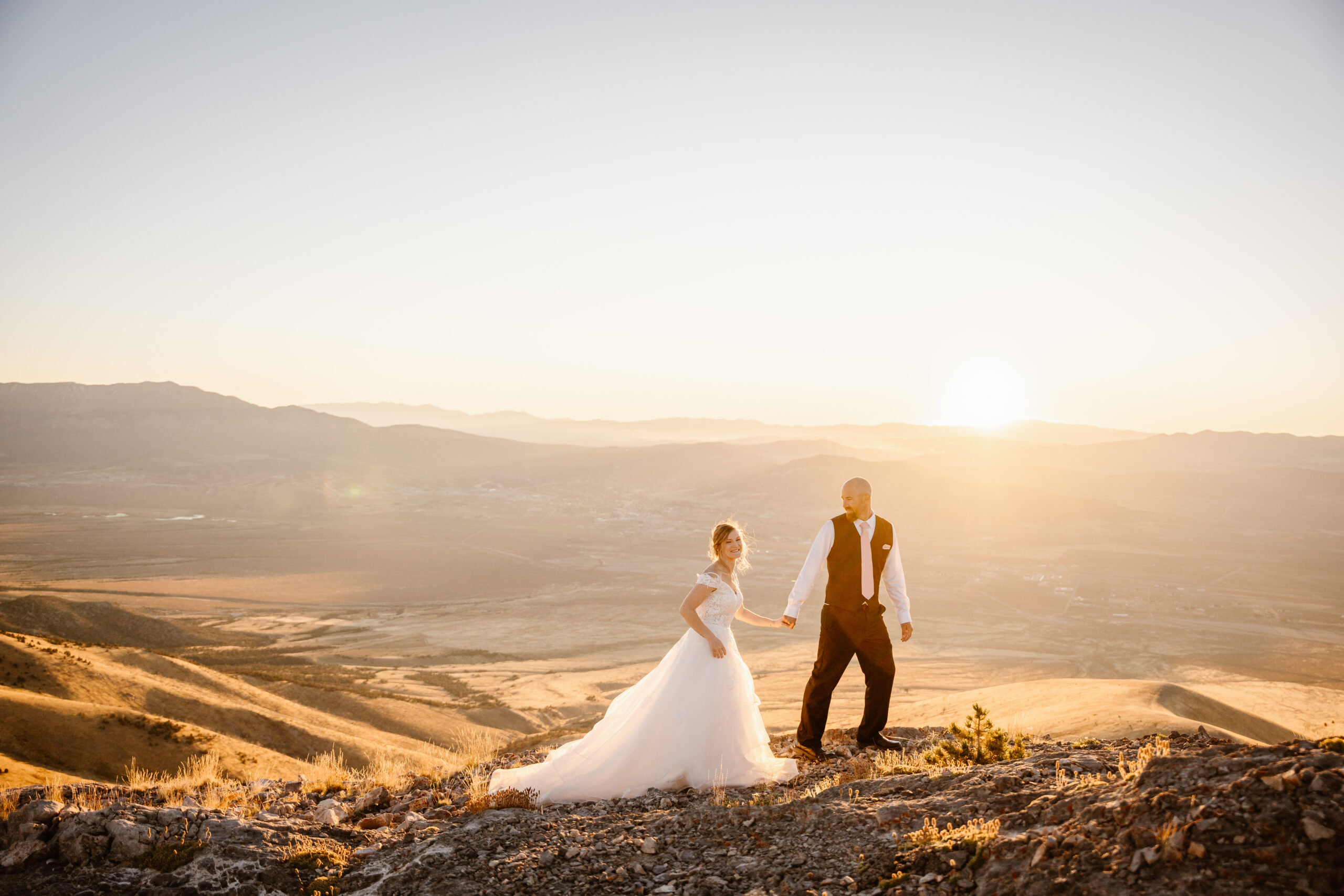 A couple gets elopement photos done on the top of a Nevada mountain range.