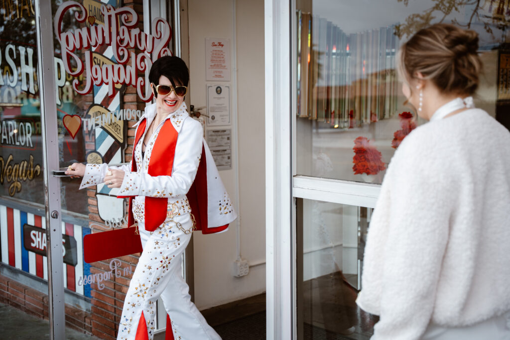 Lady Elvis opening the door at Sure Thing Chapel for a Las Vegas Elopement.